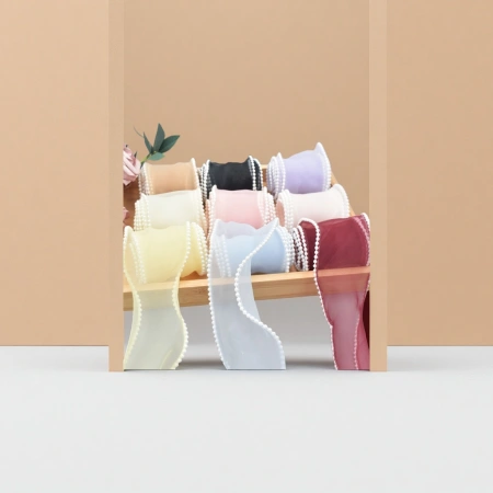 The width of the colored pearl edge mesh gauze fabric roll is 150cm, and it is available in multiple colors such as beige and light gray The width of the colored pearl edge mesh gauze fabric roll is 150cm, and it is available in multiple colors such as beige and light gray